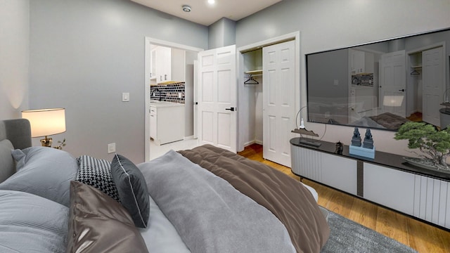 bedroom featuring light hardwood / wood-style floors and a closet