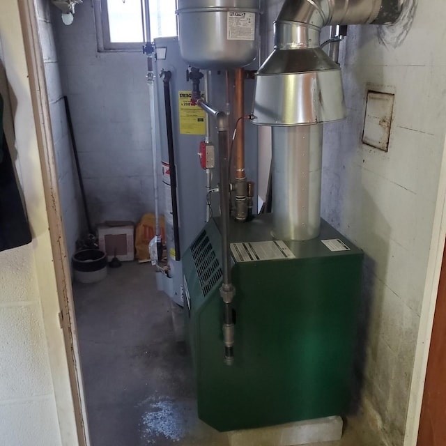 utility room with gas water heater