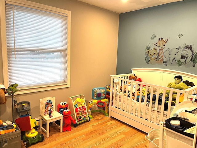 16 Sagewood Dr, Shirley, NY 11967 - bedroom with wood finished floors and a nursery area