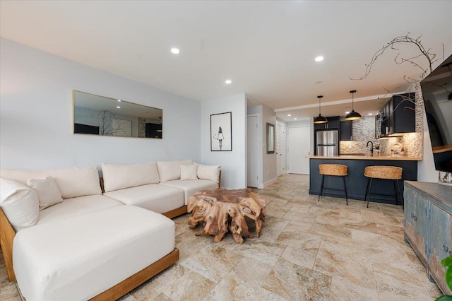 living room featuring sink