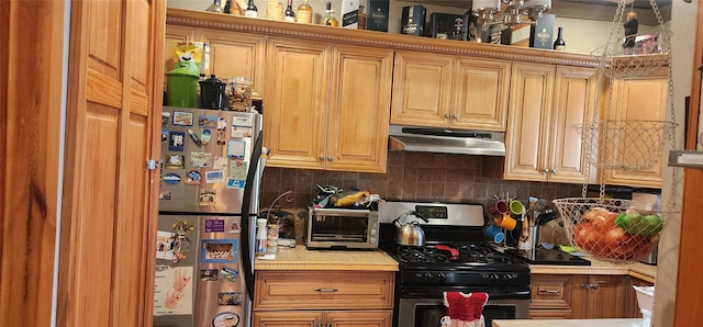 kitchen with stainless steel appliances and backsplash