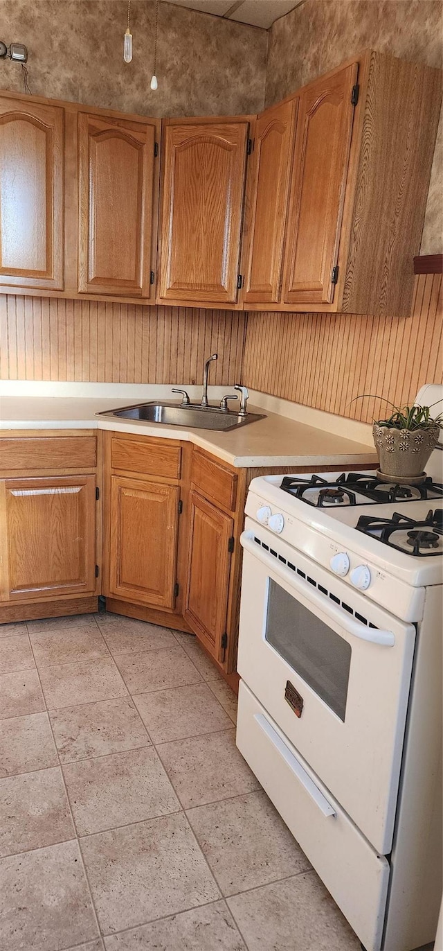 kitchen featuring sink and white gas stove