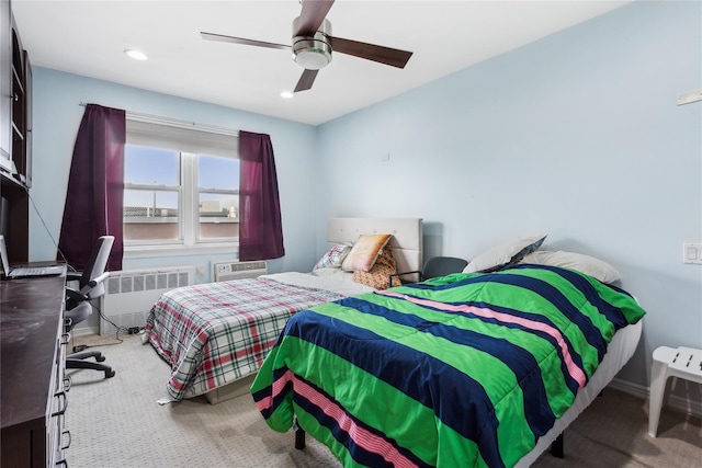 bedroom featuring radiator, ceiling fan, and carpet floors