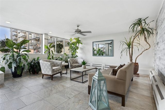 living room featuring ceiling fan and a baseboard radiator