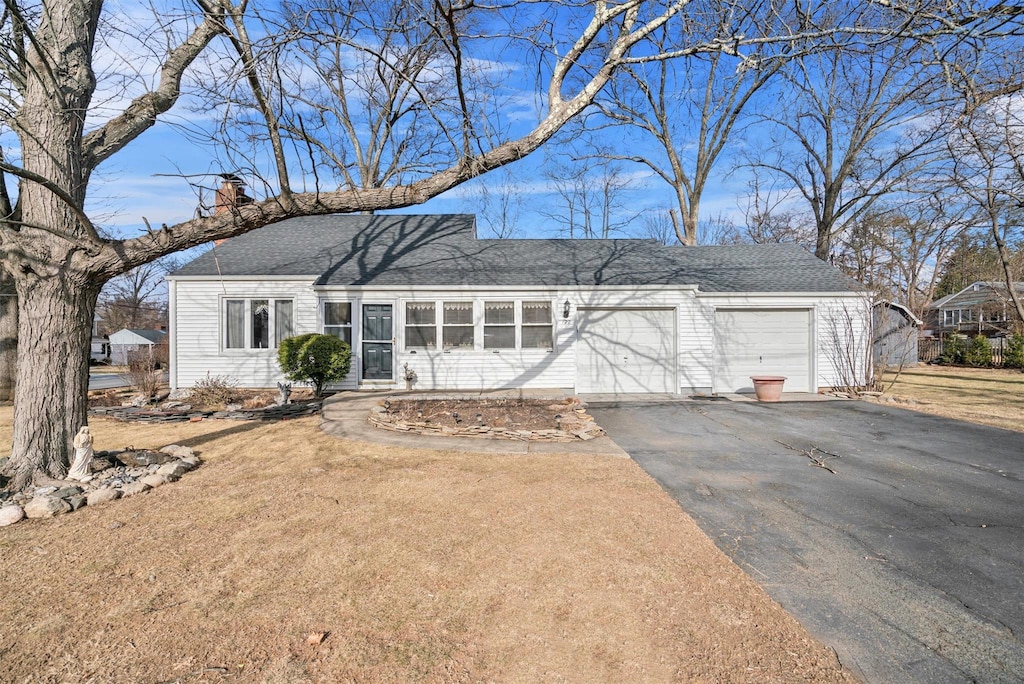 ranch-style house featuring a garage