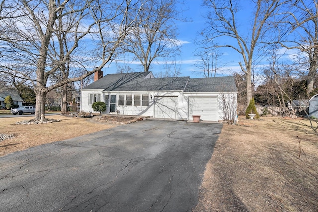 ranch-style home with a garage