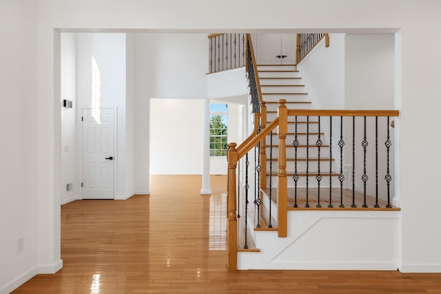 staircase featuring hardwood / wood-style floors