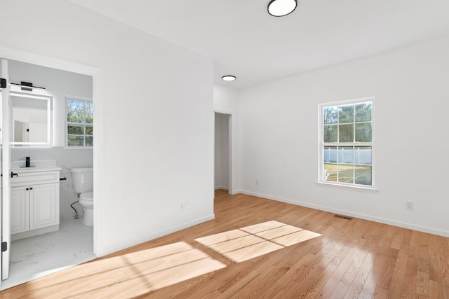 spare room with light hardwood / wood-style floors