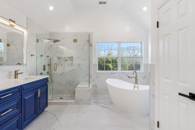 bathroom with independent shower and bath, lofted ceiling, and vanity