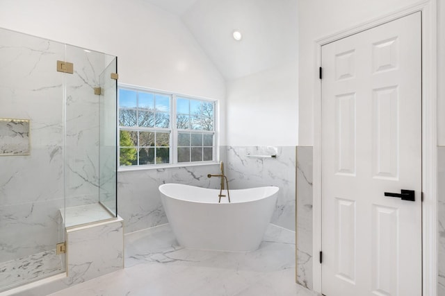 bathroom featuring plus walk in shower and vaulted ceiling