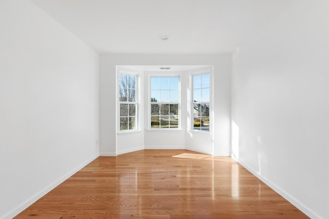 unfurnished room featuring light wood-type flooring