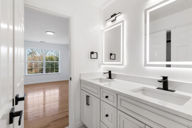 bathroom featuring vanity and hardwood / wood-style flooring