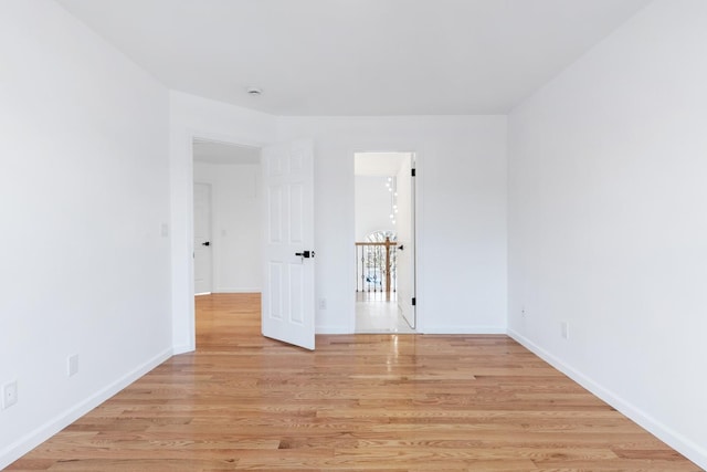 unfurnished room with light hardwood / wood-style floors