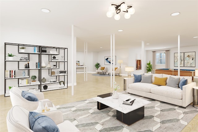 living room featuring light hardwood / wood-style floors and a notable chandelier