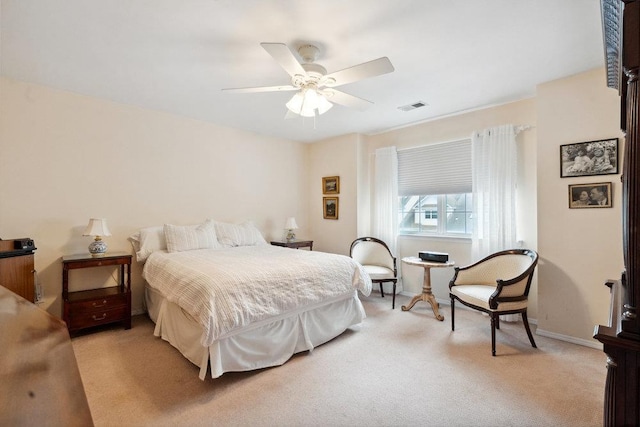 bedroom featuring ceiling fan and light colored carpet