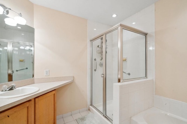 bathroom featuring tile patterned floors, vanity, and independent shower and bath