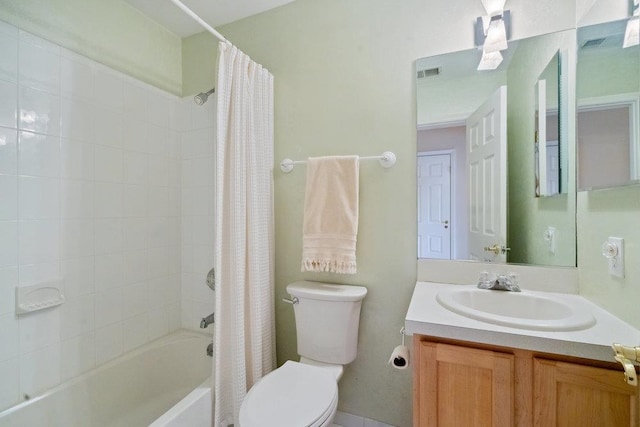 full bathroom featuring toilet, vanity, and shower / bath combo with shower curtain