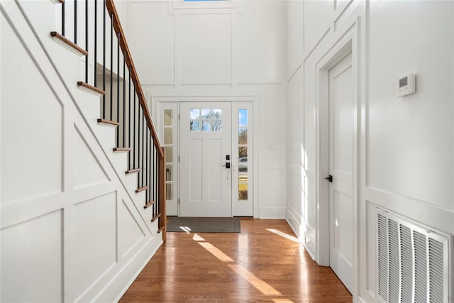 entryway with hardwood / wood-style floors