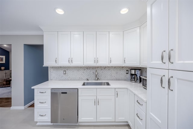 kitchen featuring stainless steel dishwasher, white cabinets, sink, and ornamental molding