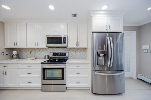 kitchen featuring tasteful backsplash, a baseboard heating unit, white cabinetry, ornamental molding, and stainless steel appliances