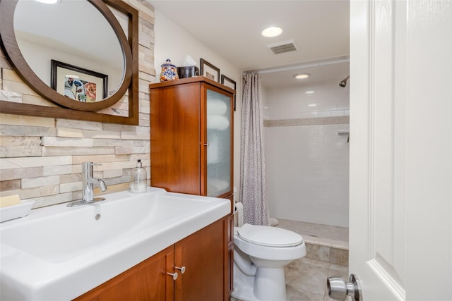 bathroom with toilet, walk in shower, and vanity