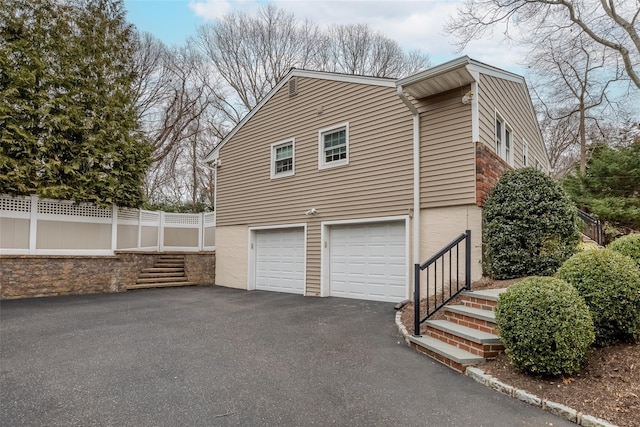 view of home's exterior with a garage