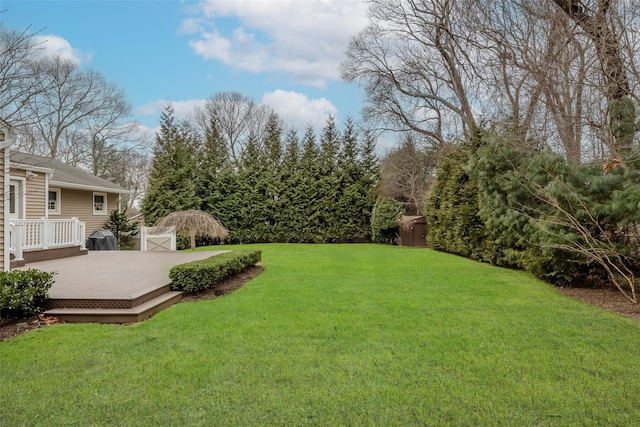 view of yard featuring a wooden deck