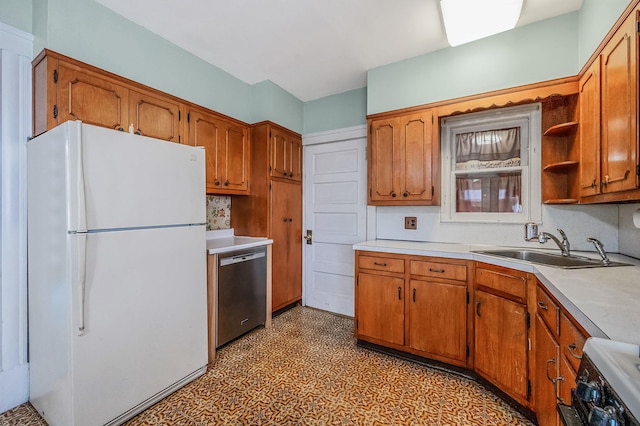 kitchen with white fridge, sink, stainless steel dishwasher, and stove