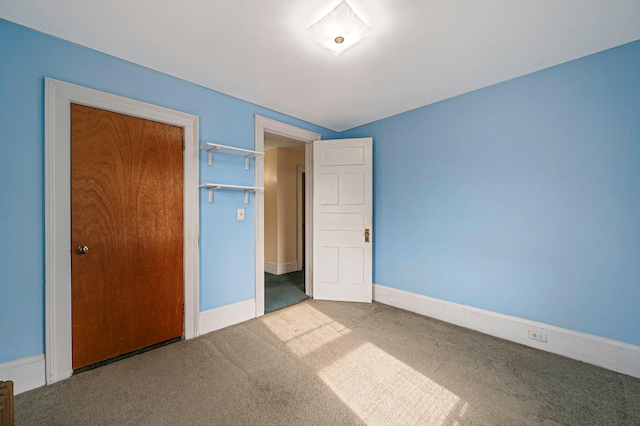 unfurnished bedroom featuring carpet