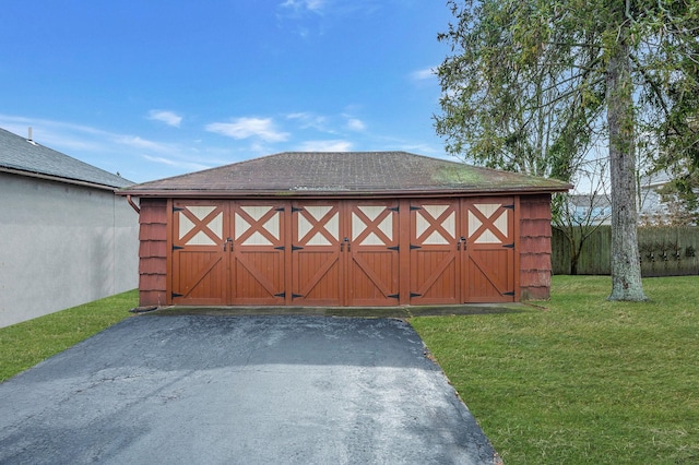 view of gate with a yard and an outdoor structure