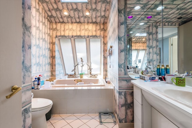 bathroom with a relaxing tiled tub, tile patterned flooring, and toilet