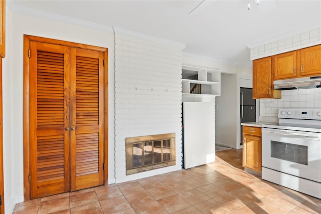 kitchen featuring crown molding, decorative backsplash, a fireplace, and electric stove