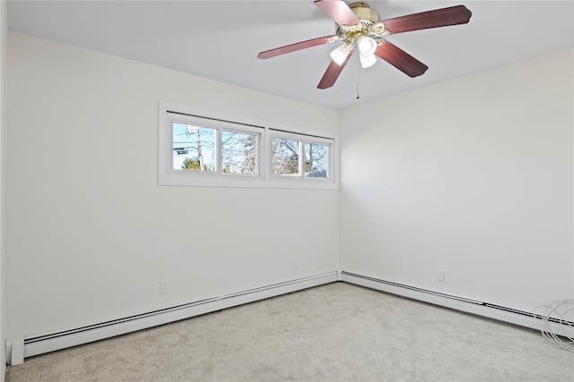 empty room with ceiling fan and baseboard heating