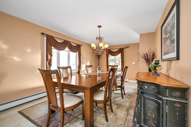 dining space with a baseboard radiator and an inviting chandelier