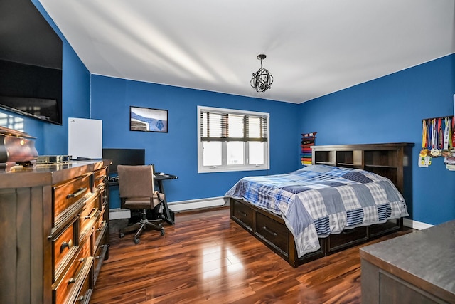 bedroom with baseboard heating and dark hardwood / wood-style flooring