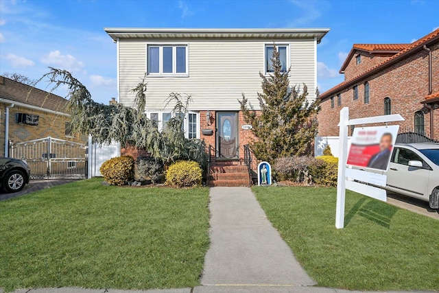 view of front of property with brick siding and a front lawn