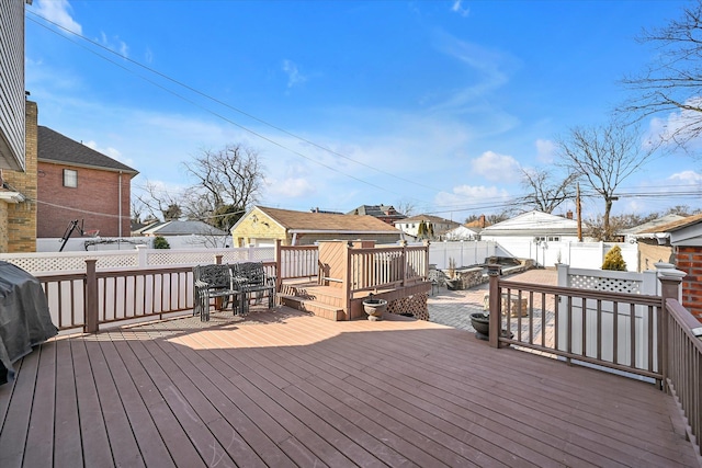 deck featuring a fenced backyard and a residential view