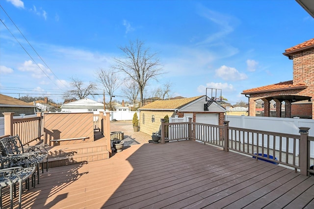 wooden deck with an outdoor structure and fence