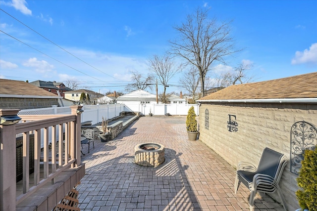 view of patio / terrace with an outdoor fire pit and a fenced backyard