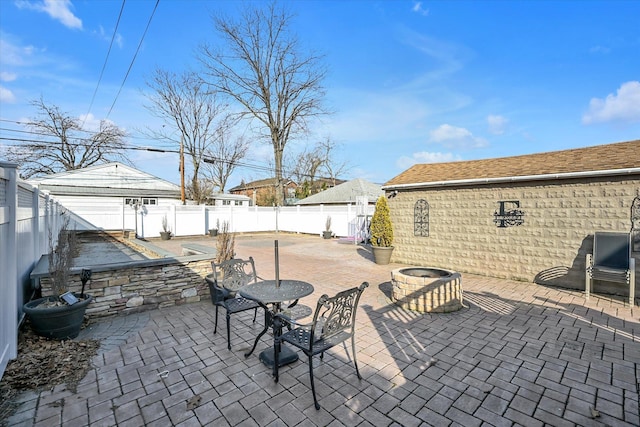 view of patio with outdoor dining area and a fenced backyard