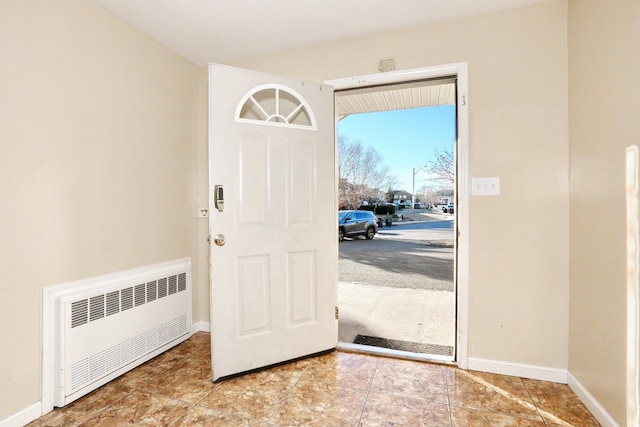 entrance foyer featuring radiator