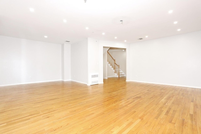 unfurnished room with light hardwood / wood-style floors