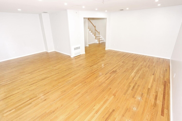 spare room featuring light hardwood / wood-style floors