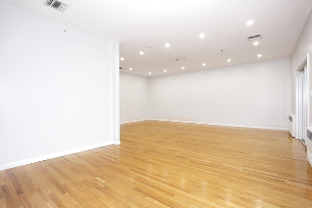 unfurnished room featuring light hardwood / wood-style flooring