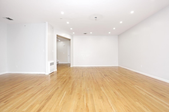 spare room with light hardwood / wood-style flooring