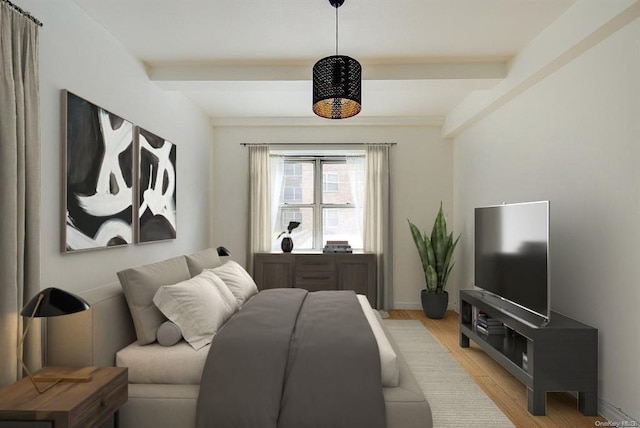 bedroom with beam ceiling and light wood-type flooring