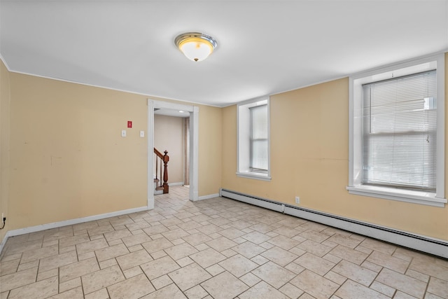 empty room featuring a baseboard radiator