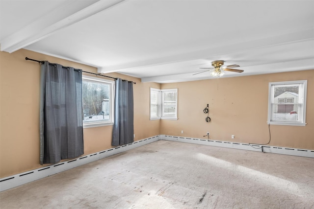 carpeted spare room with ceiling fan, a baseboard radiator, and beam ceiling