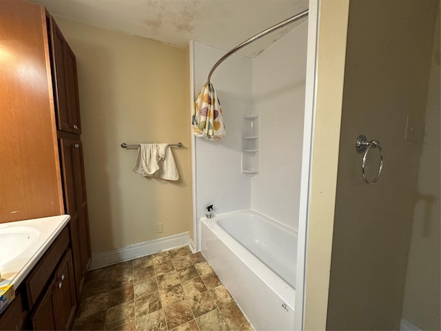 bathroom with vanity and shower / tub combination