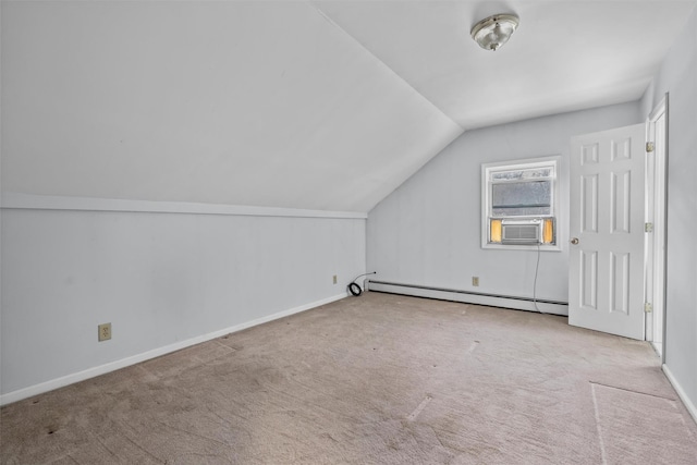 additional living space featuring vaulted ceiling, baseboard heating, light colored carpet, and cooling unit